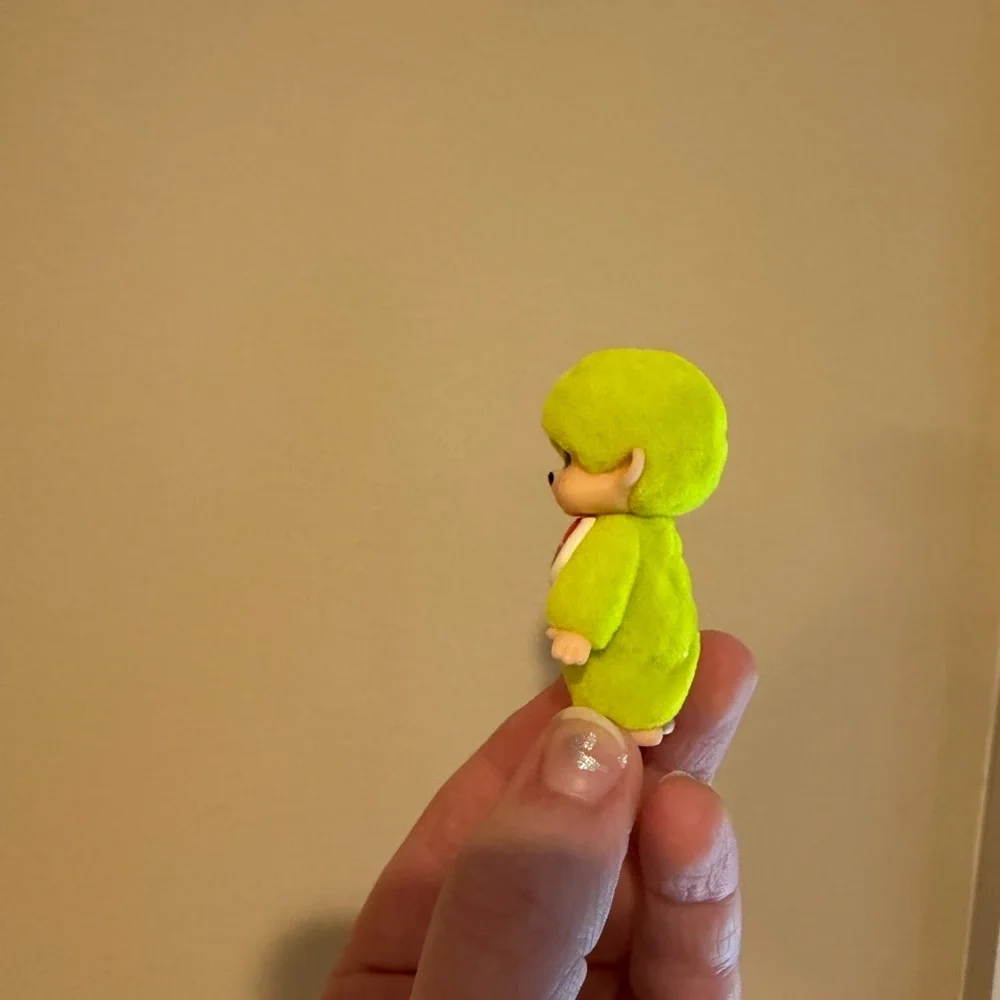 Neon yellow Monchhichi doll